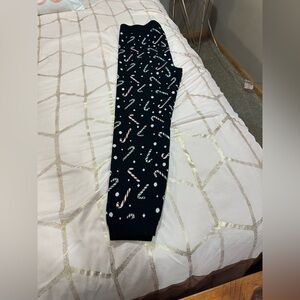 Torrid Black Leggings with Candy Cane Print